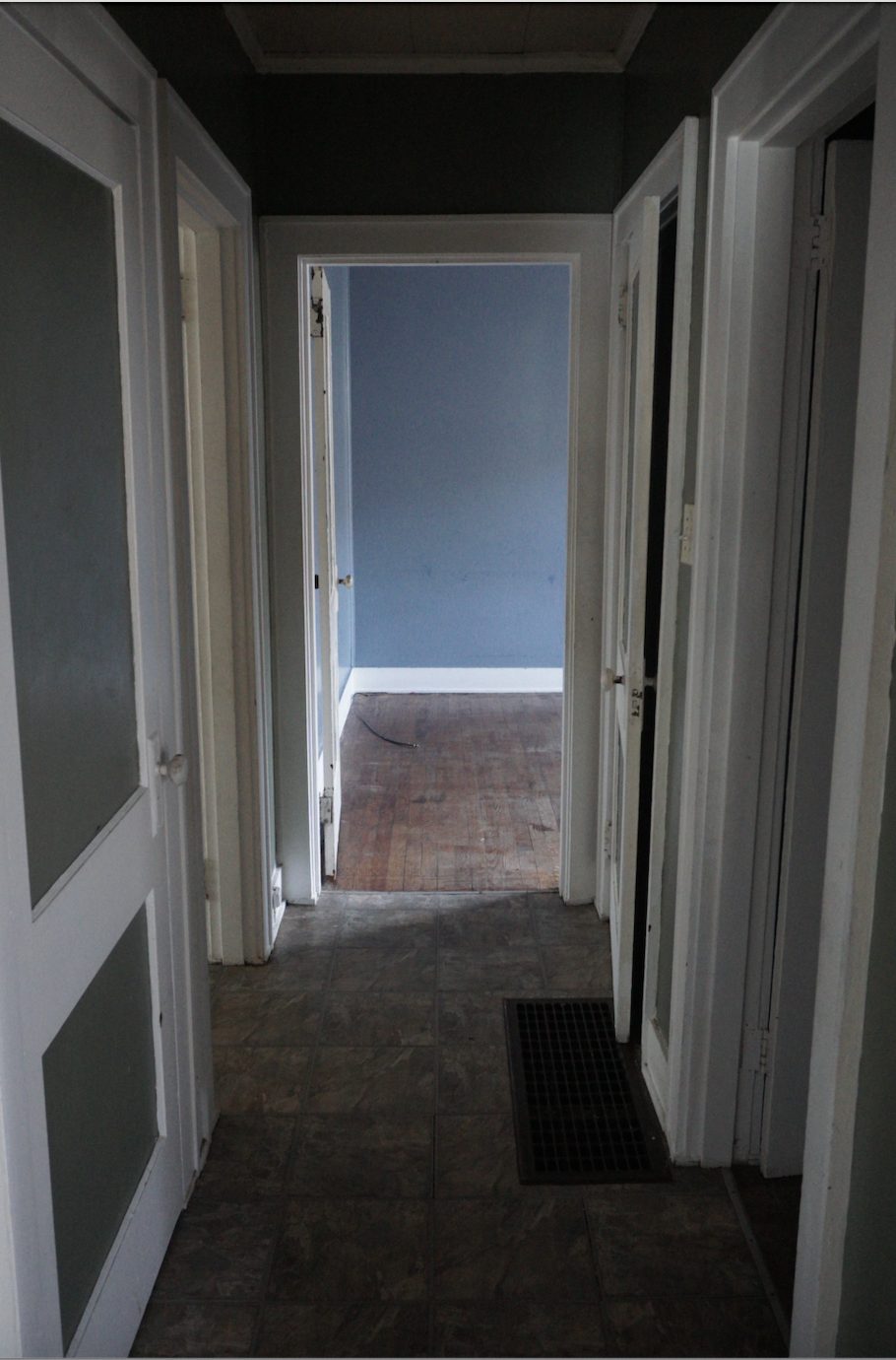 Laundry room before restoration: outdated fixtures